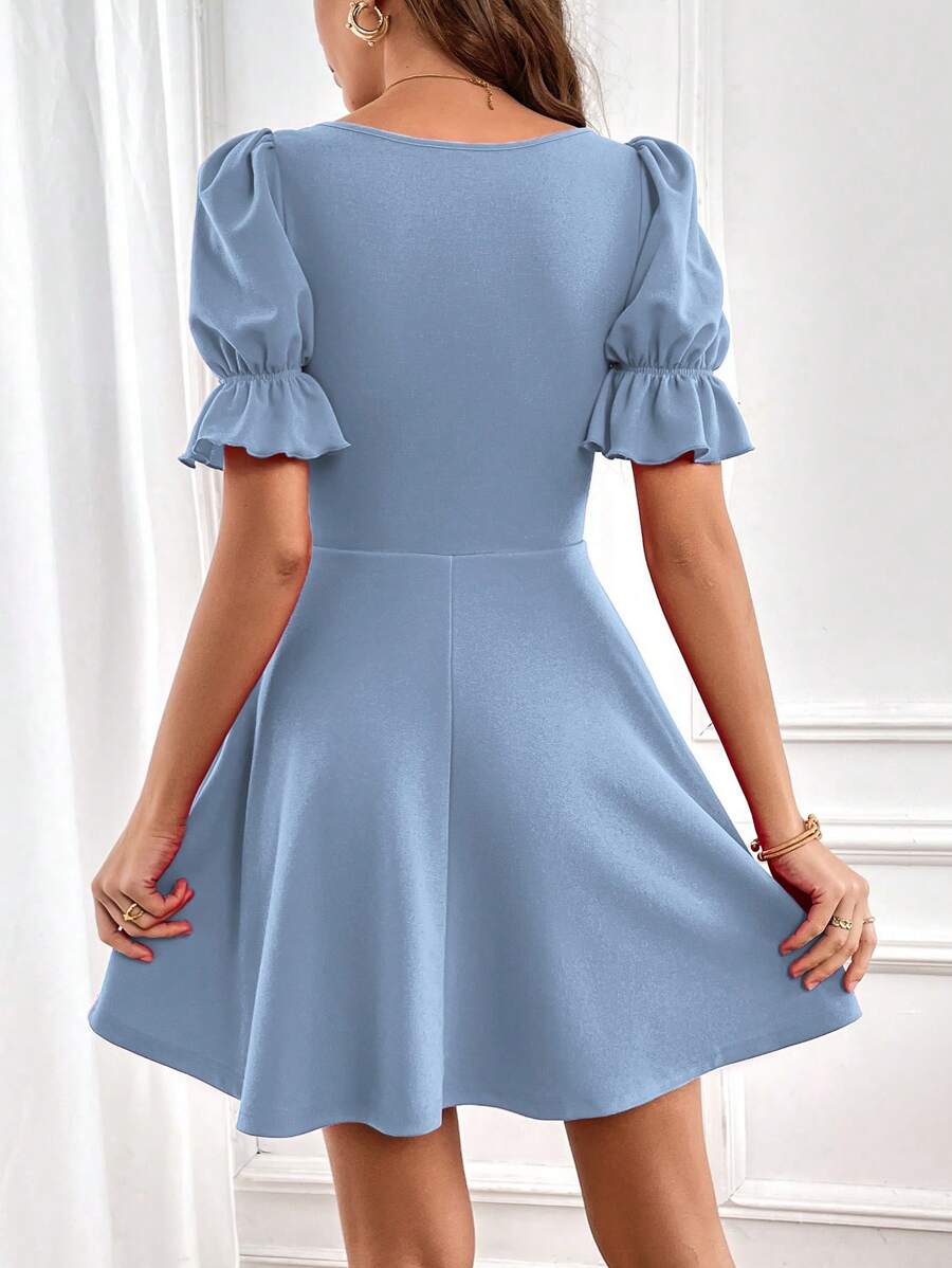 Robe élégante à manches bouffantes