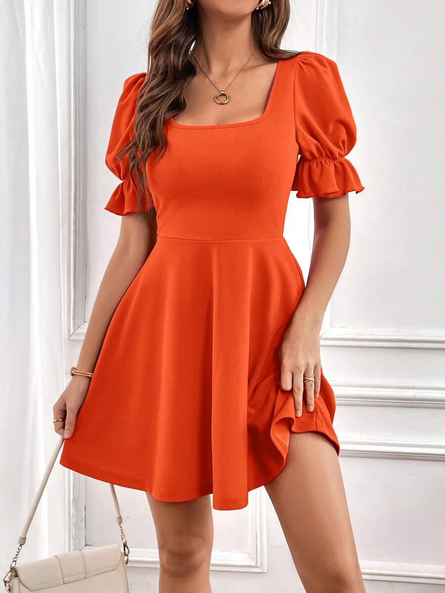 Robe élégante à manches bouffantes